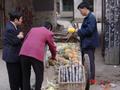 #2: Street hawker selling pineapples and sugar cane