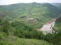 #3: View from 210 metres northwest of the confluence, which is located at the farmhouse on the opposite side of the valley