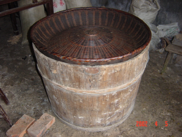 Wooden barrel used for drying tea - fire inside, tea leaves go on top