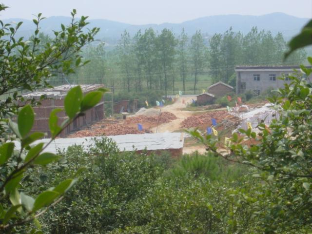 Construction site and road, as seen from hilltop
