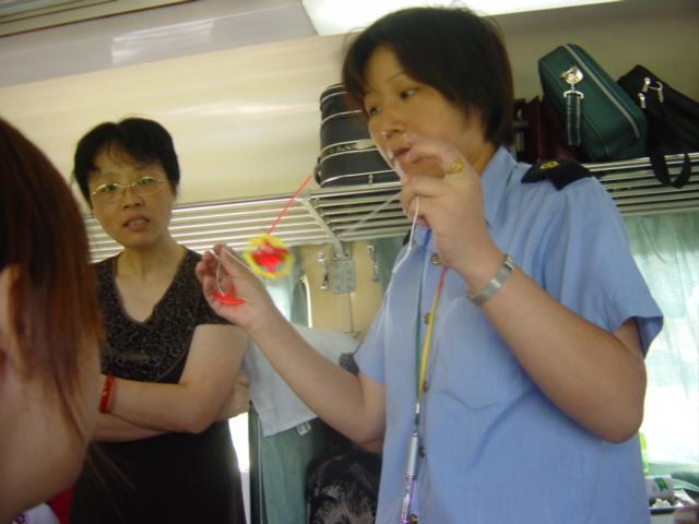 Train conductor balancing gyroscope on string