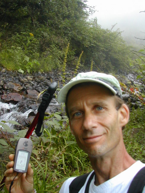 Peter at the river that swallowed the road, 1.3 km from the confluence.