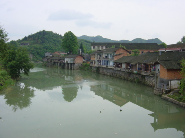 Picturesque town of Niuchehe ("Ox Cart River"), dominated by the river that flows right through the middle of it