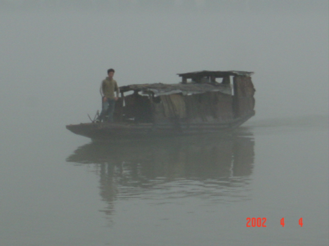 The ferry emerges from the mist