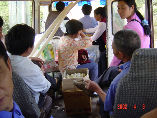 Bus from Taolin to Miluo - carton of eggs in aisle by door