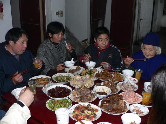 Chinese New Year's Eve feast, left to right: Xu Jing's father, mother, brother and grandmother