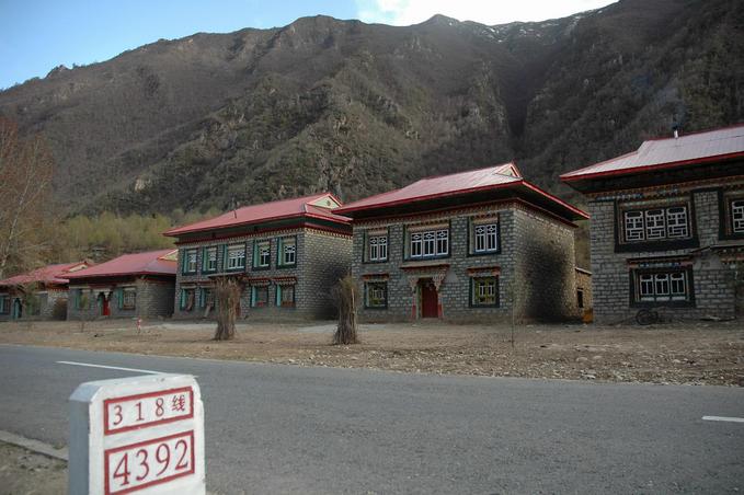 Confluence point located 1000 meters away on the central ridge behind the village