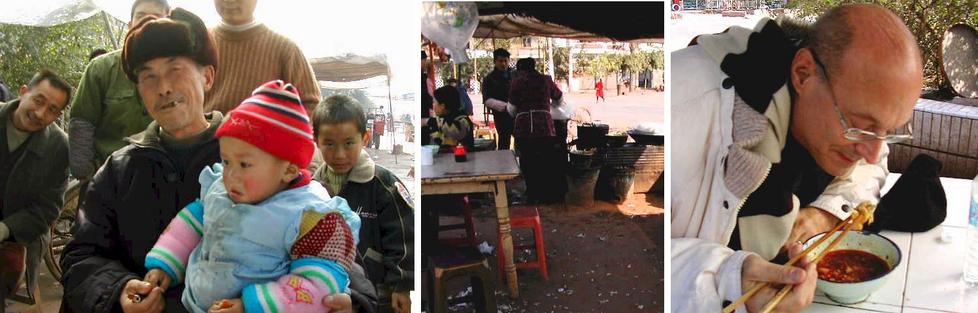 Lunch stop - Grandpa and grandchild come to check out the foreigners - the roadside "restaurant" - Mark tucking into a bowl of yummy spicy noodles