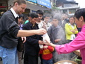 #3: Targ buys some steamed buns for breakfast as curious locals look on.