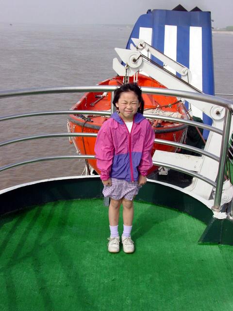 My daughter Joi on the boat as we passed close to the confluence