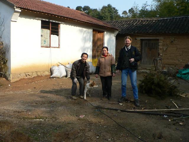 Targ with the Wangs in front of their house