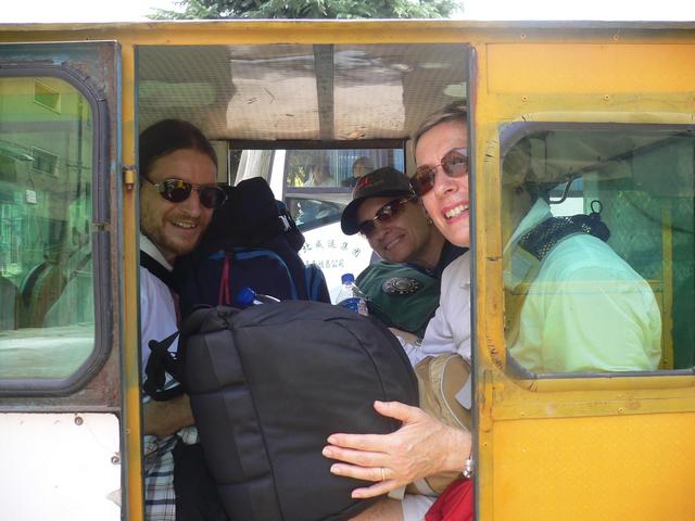 Squeezing all of us and our backpacks into a three-wheeler for the bridge crossing.