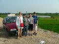 #4: Left to right: Carmen, Ah Feng, our taxi driver and Sasha, on the dirt road 180 metres from the confluence.
