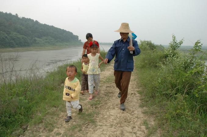 A family walking across the confluence point