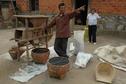 #10: Farmer processing muster seed in nearby village