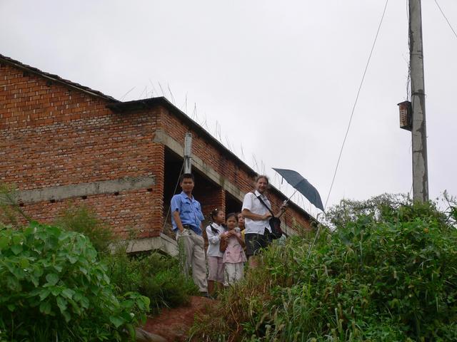 Minivan driver, Targ and local children look down from Shenjiabian Village.