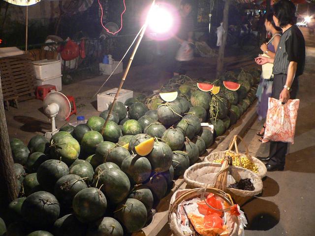 Red and yellow watermelons at Hefei street stall.