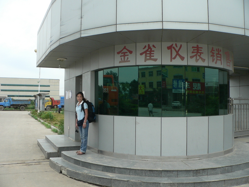 Ah Feng at the guard station in front of the factory