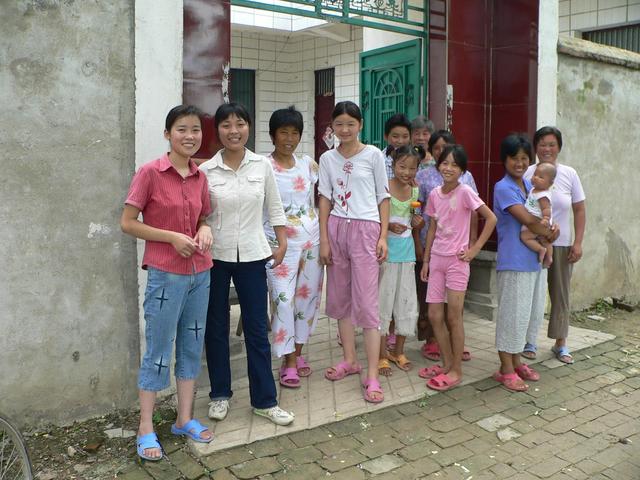 Han Xiaohua (second from left) and others out front of her home in Hanpozhai Village.