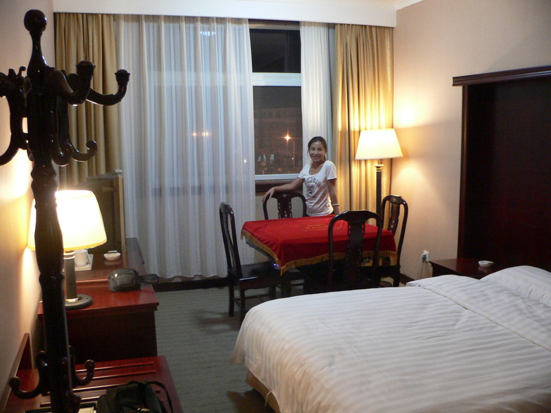 Ah Feng by the electronic mahjong table in our Lúshì Guesthouse room