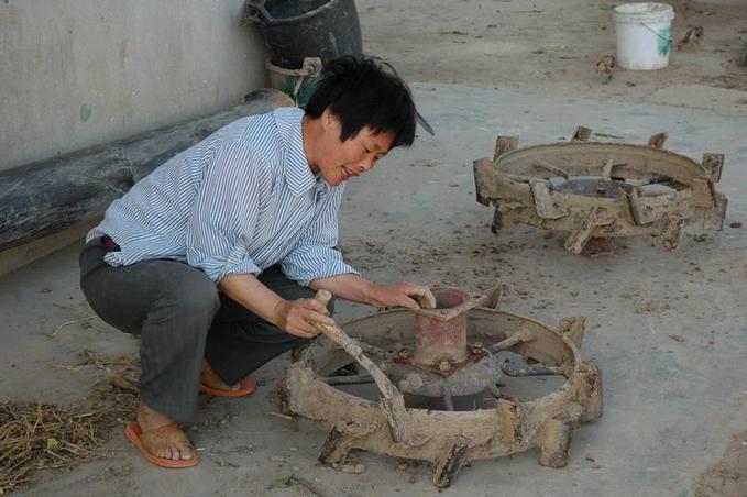 Cleaning the tractor wheels in nearby farm house