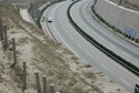 #8: The waiting car parked on the shoulder of the expressway