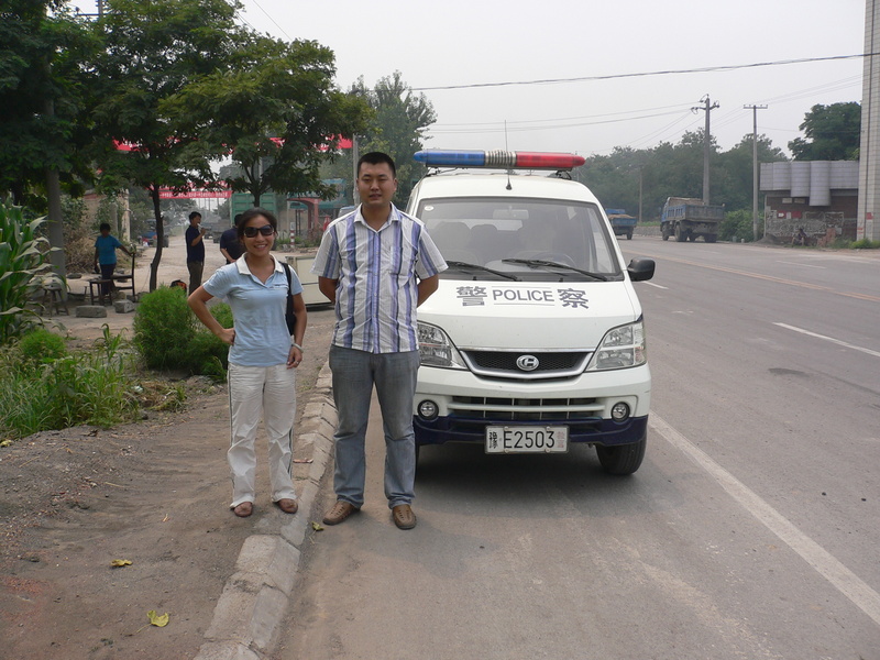 Ah Feng with our police escort at the side of the main highway