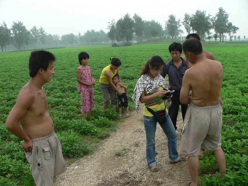 The locals telling Ah Feng the name of the nearby village