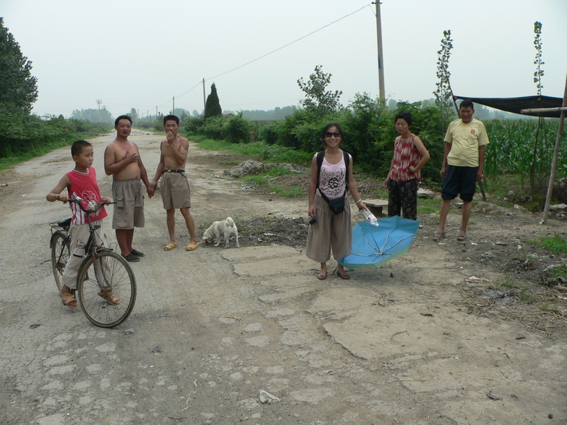 Ah Feng on the road with the Wangs and other curious locals