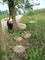 #2: Ah Feng and some abandoned millstones beside the road leading to the confluence