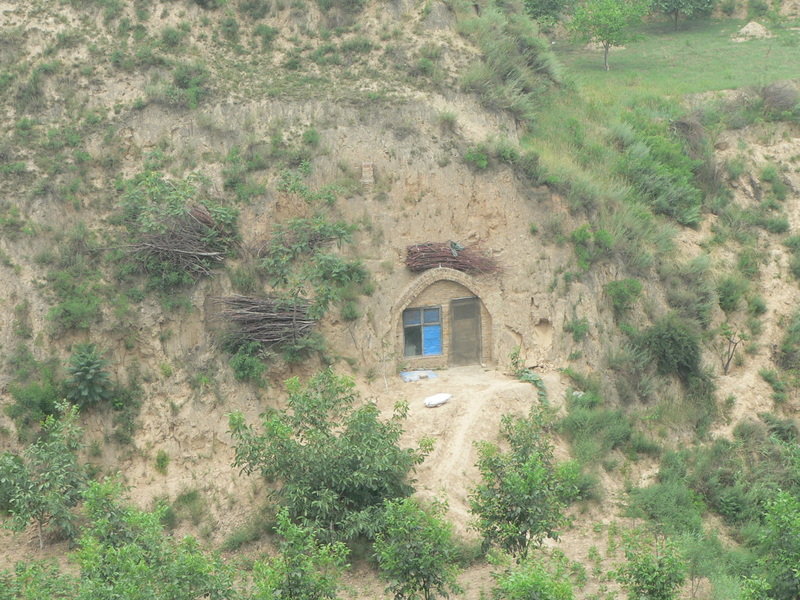 Home carved into wall of gorge