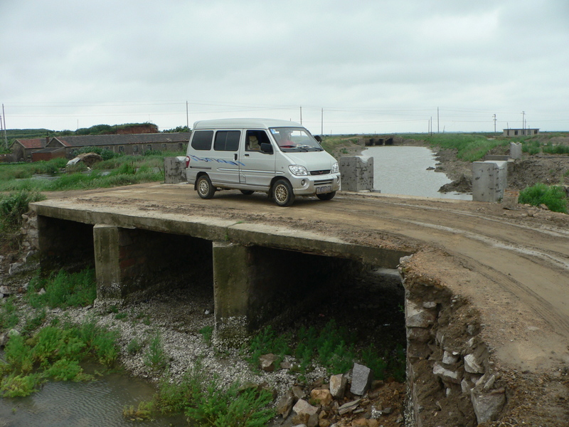 Looking SW from the confluence to our minivan, parked on the small bridge 12 m away