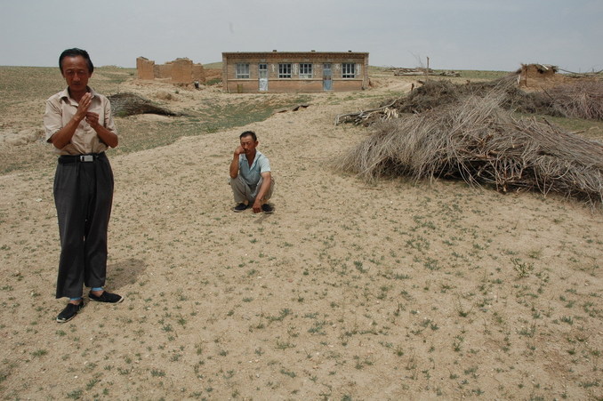 The brothers in front of their lone house near the CP