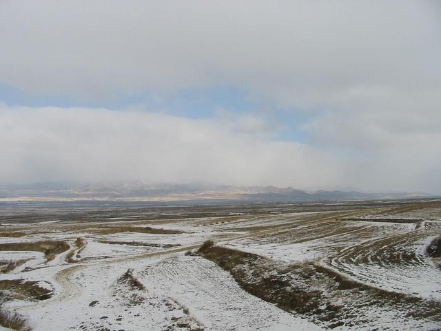 South of the conflunce point , snowing land.