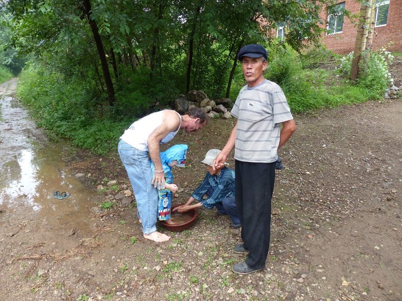 Kind locals washing Andy's feet