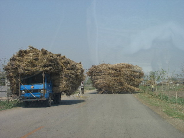 Heavy loaded truck running on road