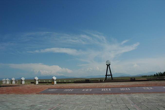 The monument surrounded by markers representing each Asian country