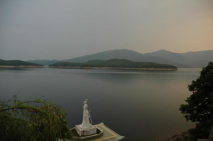 A view of the "calm as a mirror: lake from the back of our guest house in the evening
