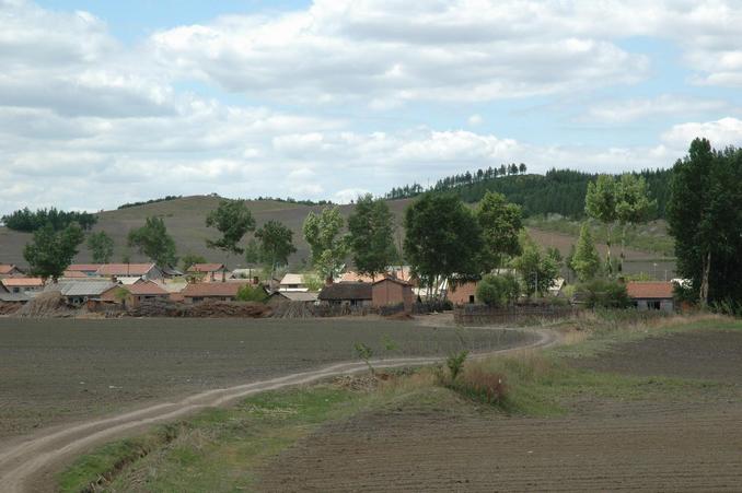 The village closest to the confleunce point - about 1 km away