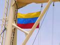 #9: The Venezuelan courtesy flag hoisted