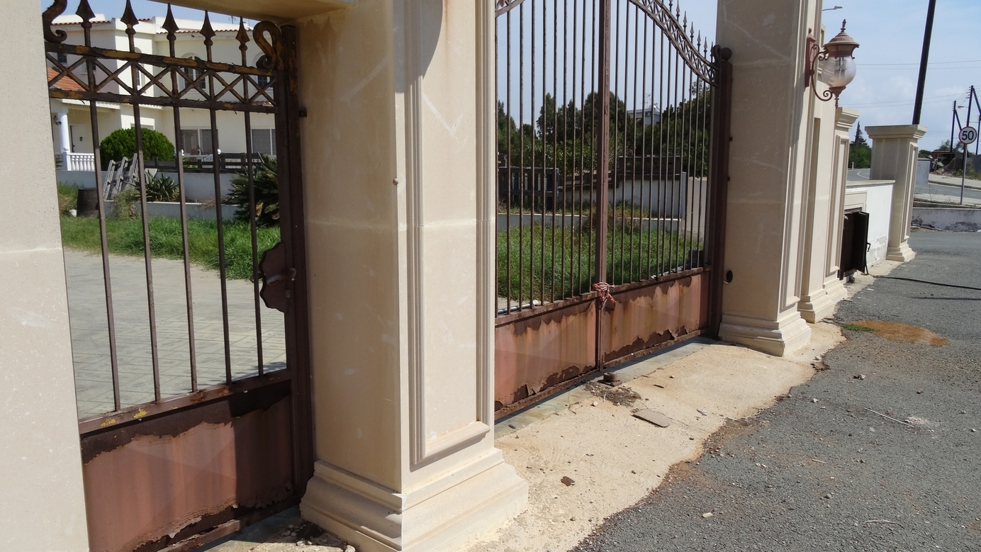 Gate of abandoned villa