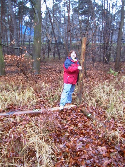 Erika at the confluence point - note fluorescent writing (50,9) on logs