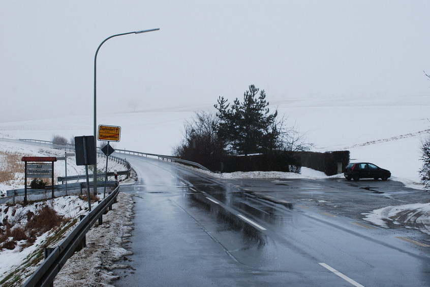 Parking at the entrance of the village