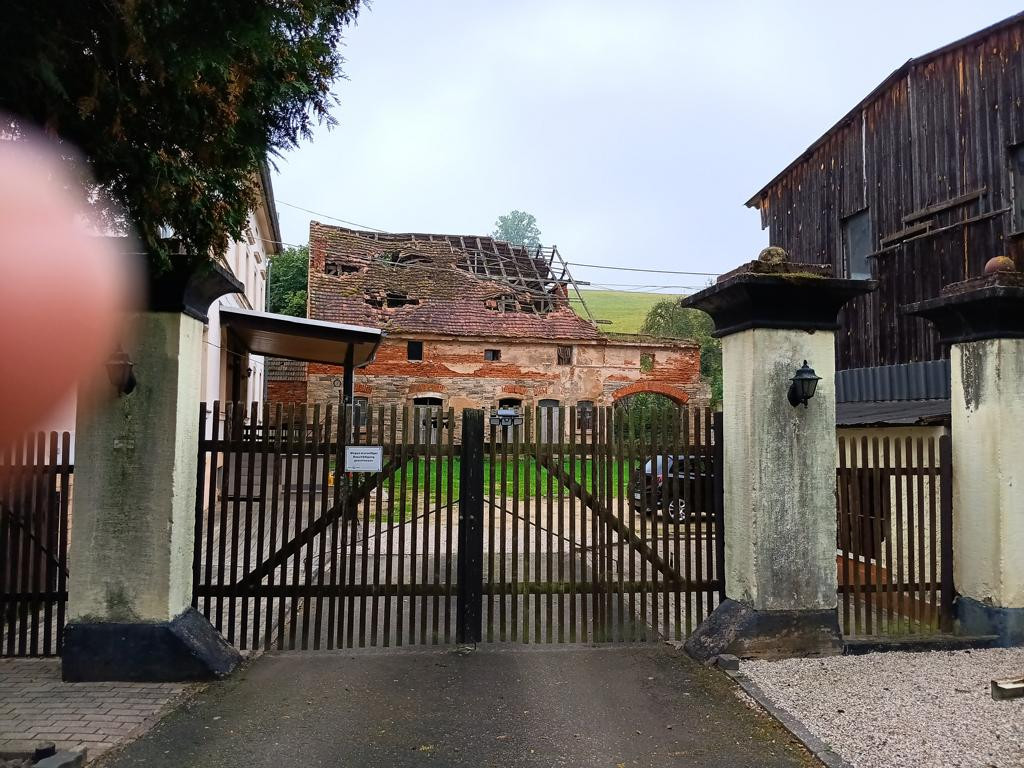 building with sign at the gate