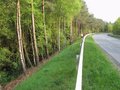 #7: The road K36 passing less than 10 m from the Confluence. The point is approx. in the picture's centre, down the slope and among the trees