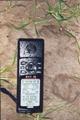 #2: My trusty GPS12 at the confluence in the pouring rain
