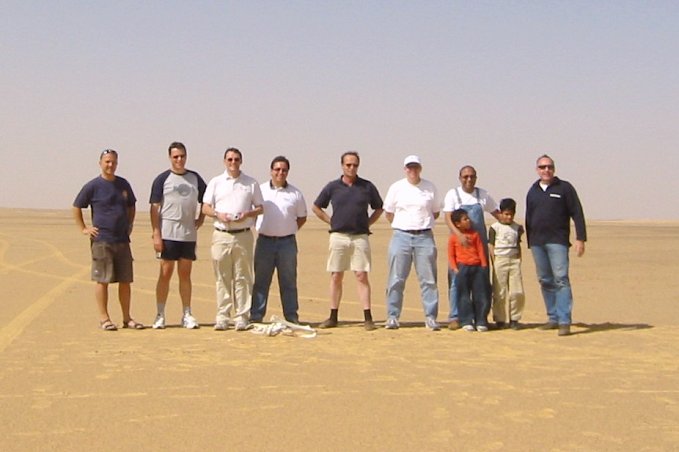 The group standing around the point with the camel bones at their feet.
