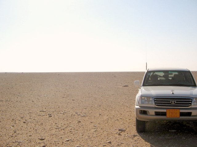 The view West... flat gravel desert and a camel or two