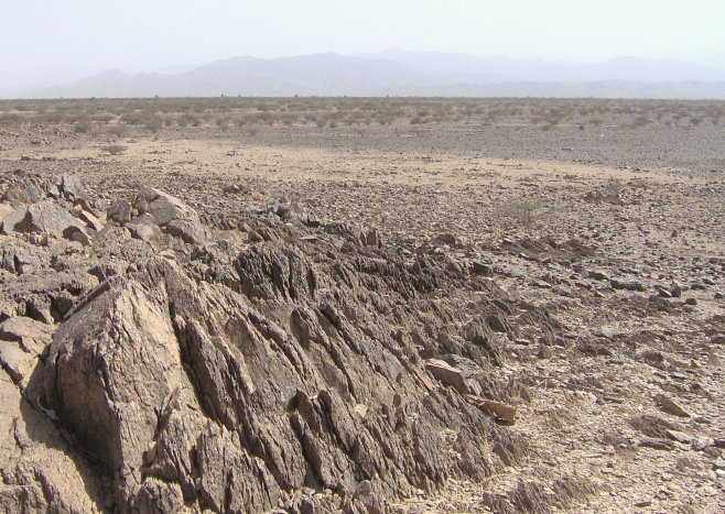 Looking down on the plain that contains the confluence point from the nearest hill (northeast of 16N 39E)