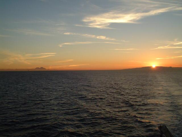 the Strait of Gibraltar, with Punta Almina and Jebel Musa at left, and Gibraltar Rock at right